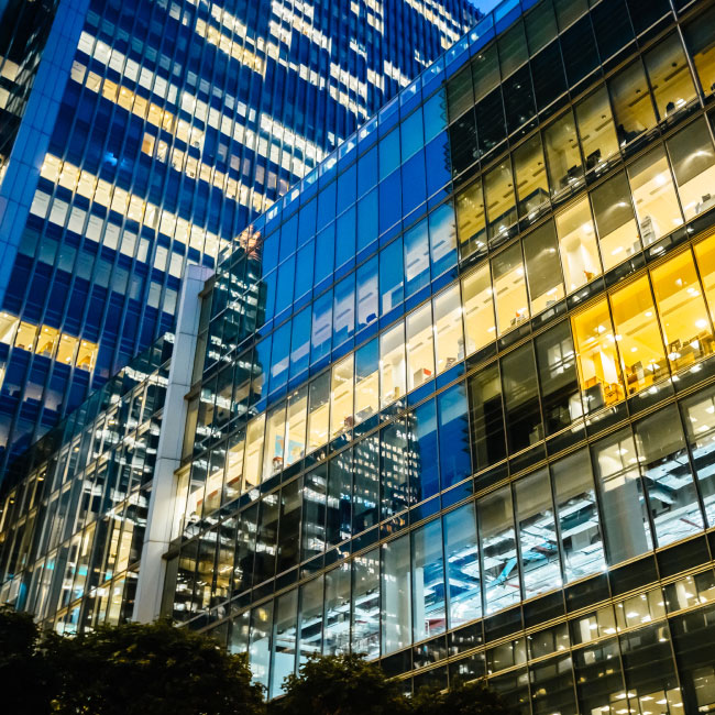 Sleek office building illuminated at night