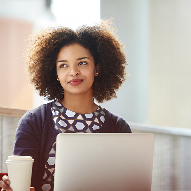 A businesswoman at a laptop, looking like she's got it all handled